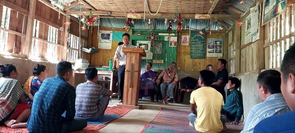 BCBT guest preacher addressing a rural church gathering