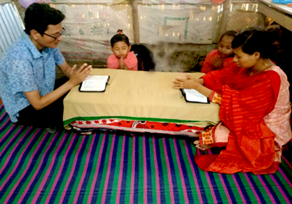BCBT family members praying and reading Scripture together