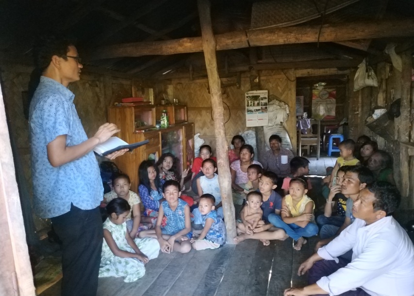 BCBT ministry discussion with families inside a village home