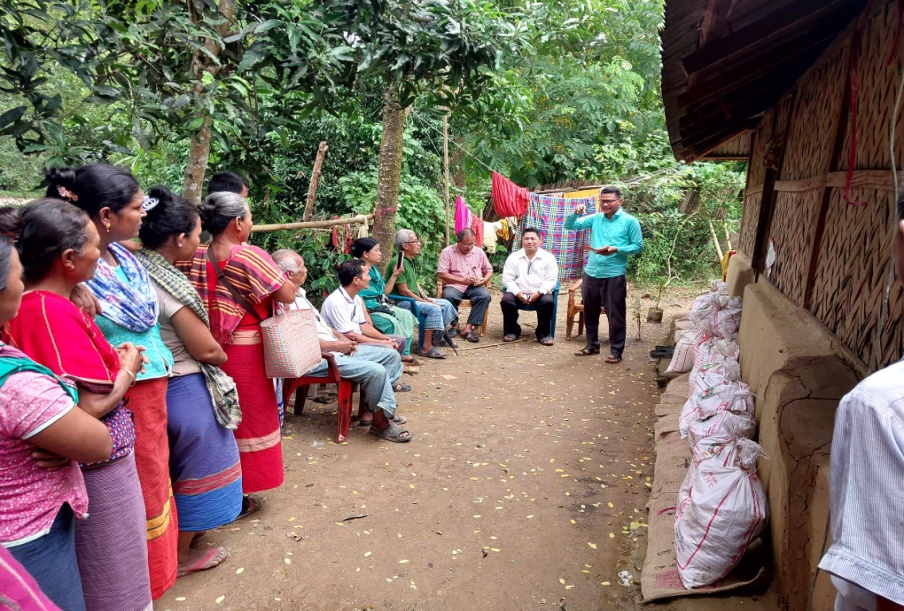 BCBT team meeting women during an outdoor village ministry visit